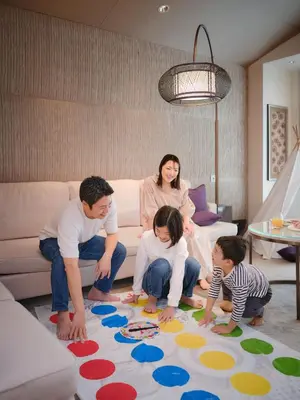 a family playing on a rug in a living room at Mandarin Oriental, Tokyo in Tokyo