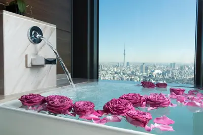 a bunch of pink roses in a bath tub at Mandarin Oriental, Tokyo in Tokyo