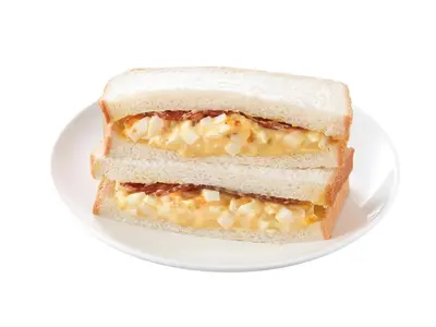 a sandwich cut in half on a white plate at Sotetsu Fresa Inn Tokyo-Akasaka in Tokyo