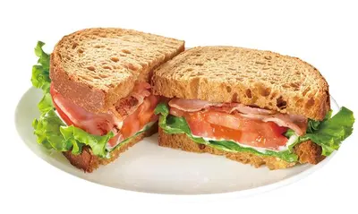 a sandwich cut in half on a white plate at Sotetsu Fresa Inn Tokyo-Akasaka in Tokyo