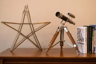 a telescope and a star on a table with books at The OneFive Tokyo Shibuya in Tokyo