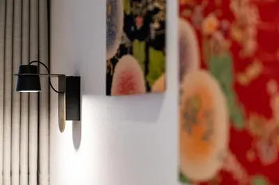 a white refrigerator with two knives hanging on it at The OneFive Tokyo Shibuya in Tokyo