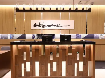a conference room with two laptops on a table at Hotel Gracery Asakusa in Tokyo