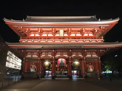 a large building with an asian roof at night at Hotel Gracery Asakusa in Tokyo