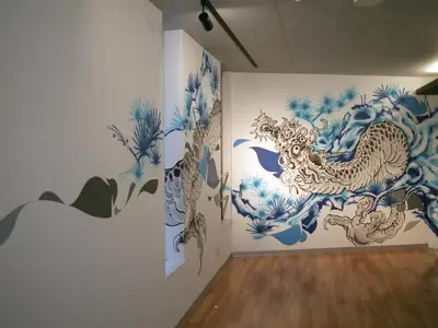 a room with blue and white paintings on the walls at The Aoca Tokyo Sanno in Tokyo
