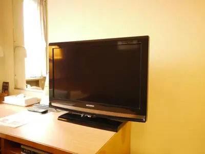 a flat screen tv sitting on top of a desk at Hotel Route-Inn Shinagawa-Oimachi in Tokyo