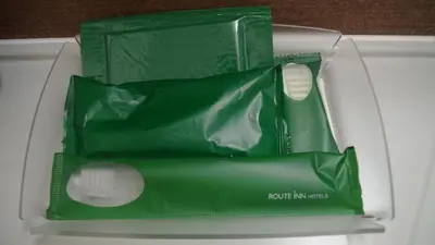 a green box with two white balls in it at Hotel Route-Inn Shinagawa-Oimachi in Tokyo