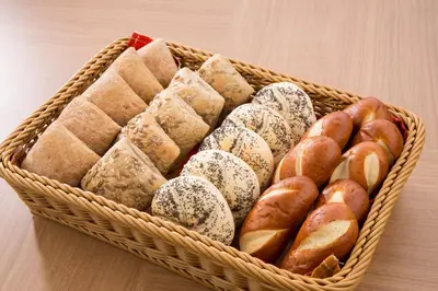 a basket filled with lots of different types of pastries at Hotel Route-Inn Tokyo Asagaya in Tokyo