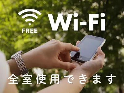 a person holding a cell phone in their hands at Hotel Route-Inn Tokyo Asagaya in Tokyo