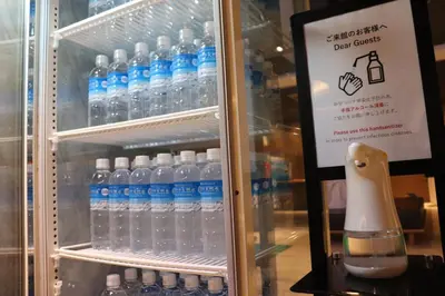 a refrigerator filled with lots of bottles of water at Hotel Asia Center of Japan in Tokyo