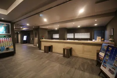 a lobby of a hospital with a waiting room and a counter at Hotel Route-Inn Grand Tokyo Toyocho in Tokyo