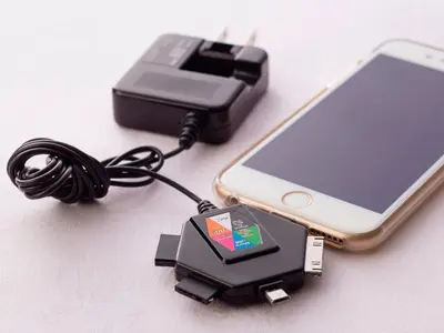 a charger for a cell phone and a cell phone adapter at Hotel Route-Inn Tokyo Ikebukuro in Tokyo