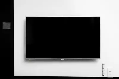 a flat screen tv hanging on a wall at Hotel Sunlite Shinjuku in Tokyo