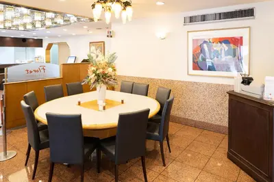 a dining room with a table and chairs at Hotel Sunlite Shinjuku in Tokyo