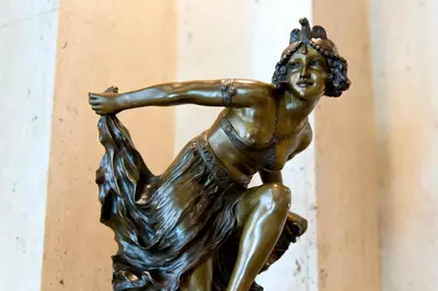 a bronze statue of a woman dancing at Hotel Sunlite Shinjuku in Tokyo