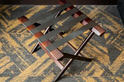 a wooden chair sitting on top of a carpet at HOTEL MYSTAYS Hamamatsucho in Tokyo