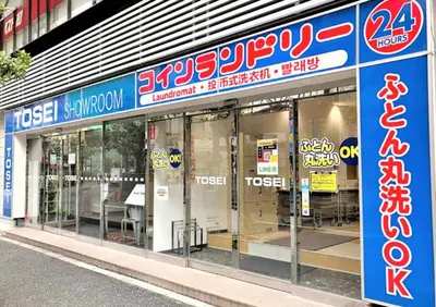 a store front of a store with glass doors at Hills Hotel Gotanda in Tokyo