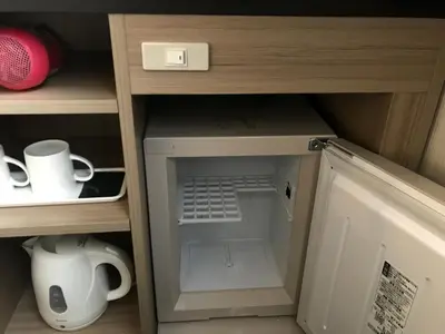 a small cabinet with a laptop inside of it at Smile Hotel Tokyo Asagaya in Tokyo
