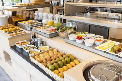 a buffet line with many different types of food at HOTEL 1899 TOKYO in Tokyo