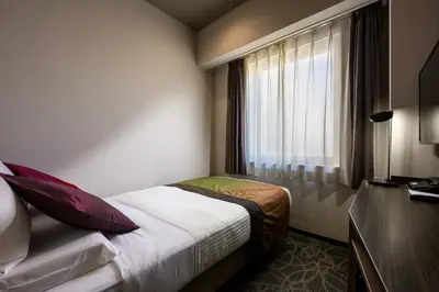 a hotel room with a bed and a window at HOTEL MYSTAYS Ueno East in Tokyo