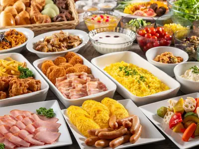 a table with many different types of food in bowls at HOTEL MYSTAYS Ueno East in Tokyo