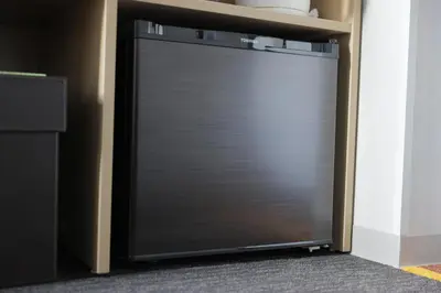 a metal garage door with a shelf on top at Super Hotel Tokyo Otsuka in Tokyo