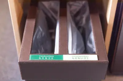 a brown box with a pair of shoes in it at Super Hotel Tokyo Otsuka in Tokyo
