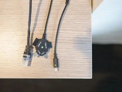 two electronic devices are hanging on a table at Super Hotel Tokyo Otsuka in Tokyo