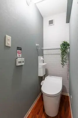 a bathroom with a white toilet and a sink at Premier suite MEGURO Tokyo in Tokyo