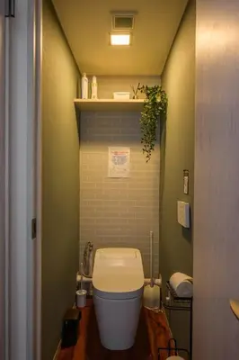 a bathroom with a toilet in a small room at Premier suite MEGURO Tokyo in Tokyo
