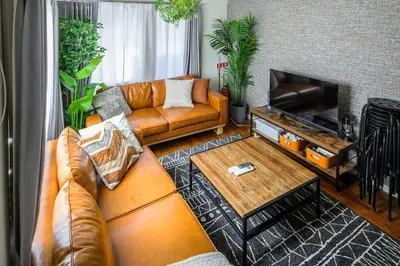 a living room with a couch and a table at Premier suite MEGURO Tokyo in Tokyo