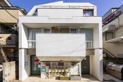a white building with a white roof at Premier suite MEGURO Tokyo in Tokyo