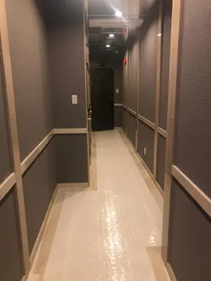 a hallway with a row of stalls in a building at Hotel U in Tokyo