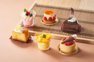 a group of cakes and desserts on a table at Hotel Tokyo Garden Palace in Tokyo