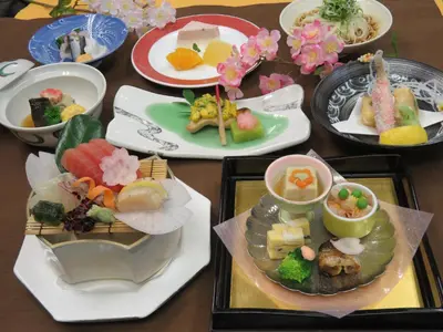 a table with several plates of food on it at Hotel Tokyo Garden Palace in Tokyo