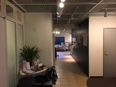 a hallway of an office with a table and chairs at Hotel Palace Japan in Tokyo