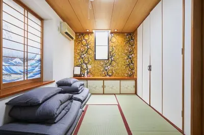 a small room with a couch and a window at Luxury Guest House in Tokyo Shinjuku in Tokyo