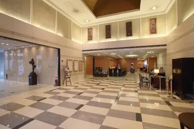 a lobby with a checkered floor in a building at Dai-ichi Hotel Ryogoku in Tokyo