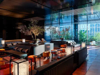 a restaurant with tables and chairs and a large window at Mitsui Garden Hotel Nihonbashi Premier in Tokyo