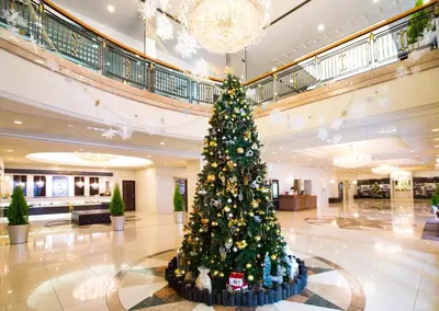 a christmas tree in the middle of a lobby at Hotel Bellclassic Tokyo in Tokyo