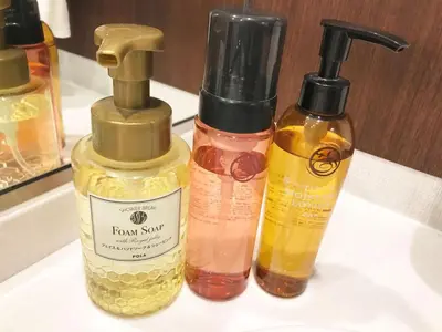 three bottles of hair products sitting on a sink at Hotel Bellclassic Tokyo in Tokyo