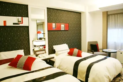 a hotel room with two beds in a room at New Otani Inn Tokyo in Tokyo
