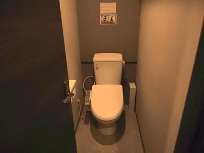 a bathroom with a white toilet in a stall at bnb+ Secret Base Mejiro in Tokyo