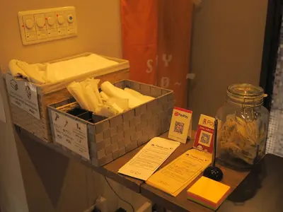 a table with a box of cheese on a counter at bnb+ Secret Base Mejiro in Tokyo