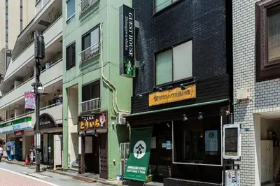 a group of buildings on a city street at Shinagawa-shuku Guest House & Tours in Tokyo