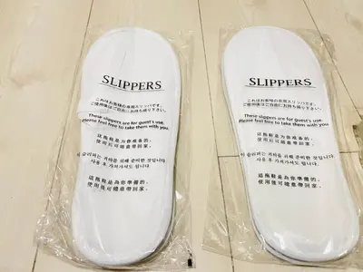 a pair of white shoes in a plastic bag at Shimokitazawa Independent Apartment in Tokyo