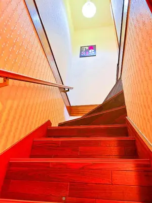 a set of stairs in a house with a window at yikebukuro LuckyHouse \u6c60\u888b\u4e00\u8ed2\u5bb6 \u5e78\u904b\u306e\u5bb6 in Tokyo