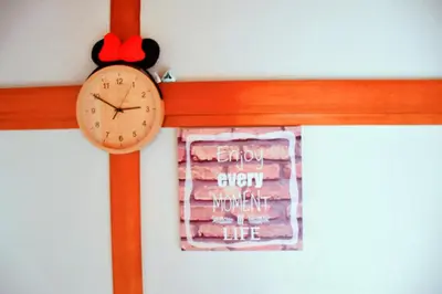 a clock hanging on a wall with a window at yikebukuro LuckyHouse \u6c60\u888b\u4e00\u8ed2\u5bb6 \u5e78\u904b\u306e\u5bb6 in Tokyo