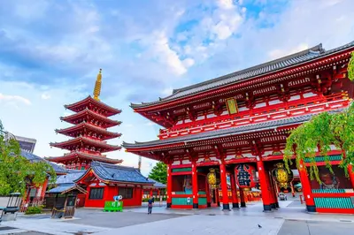 a red building with a pagoda in a city at The Westin Tokyo in Tokyo