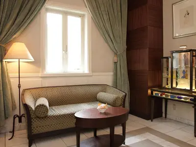 a living room with a couch and a window at Hotel Monterey Lasoeur Ginza in Tokyo